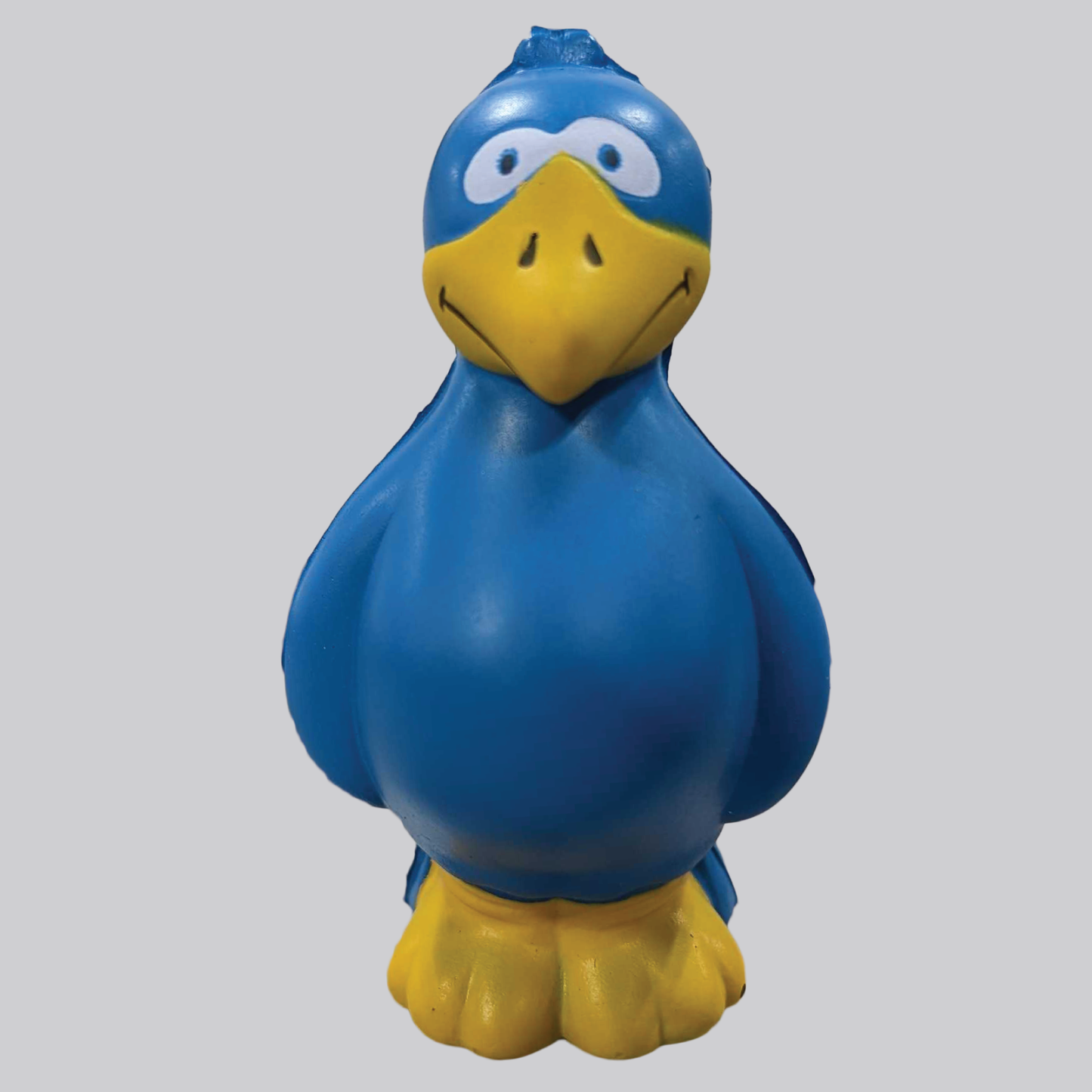 A small figurine of Larry Bird that looks invitingly squishy. He stands with his wings at his sides, all royal blue with a yellow beak and feet. 